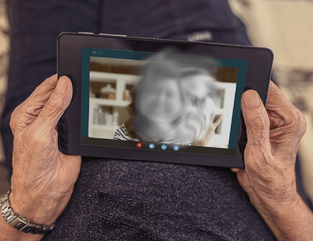 images of patient with GA looking at tablet